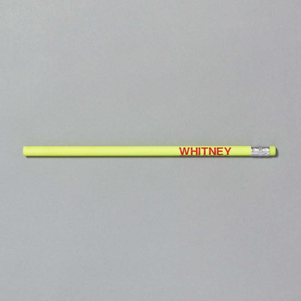 Yellow pencil with 'WHITNEY' branding on a gray background