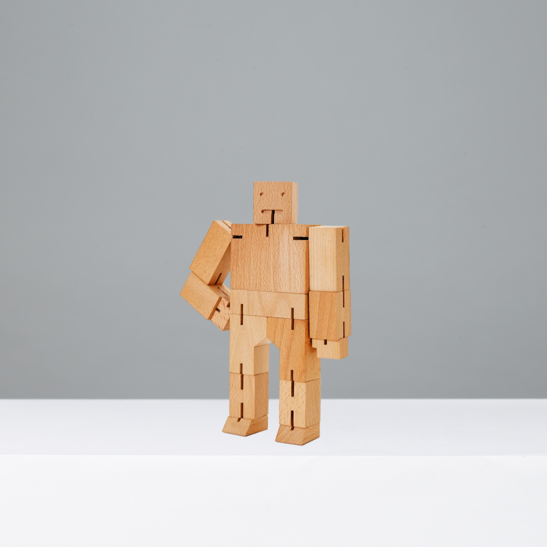 Wooden robot puzzle toy on a gray background