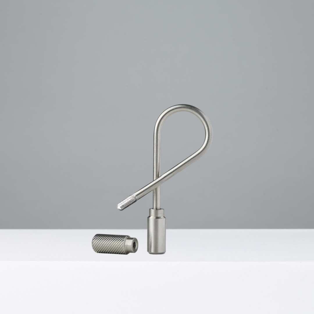 Stainless steel closed helix keyring on a gray background