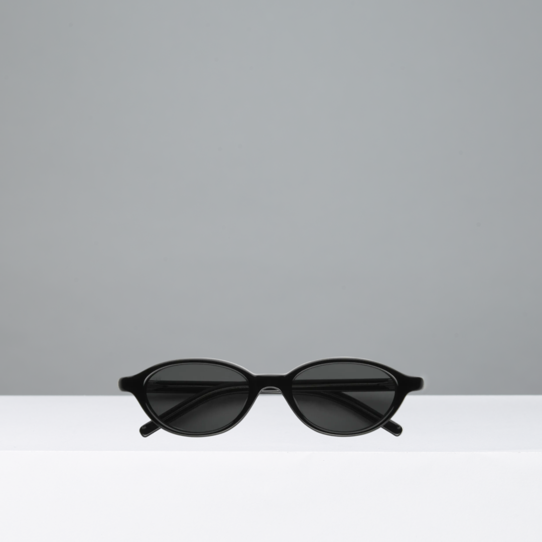 Black sunglasses on a light gray background
