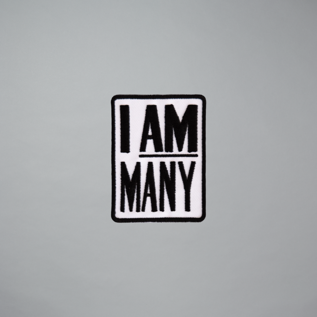 Embroidered patch featuring I AM MANY by Jeffrey Gibson