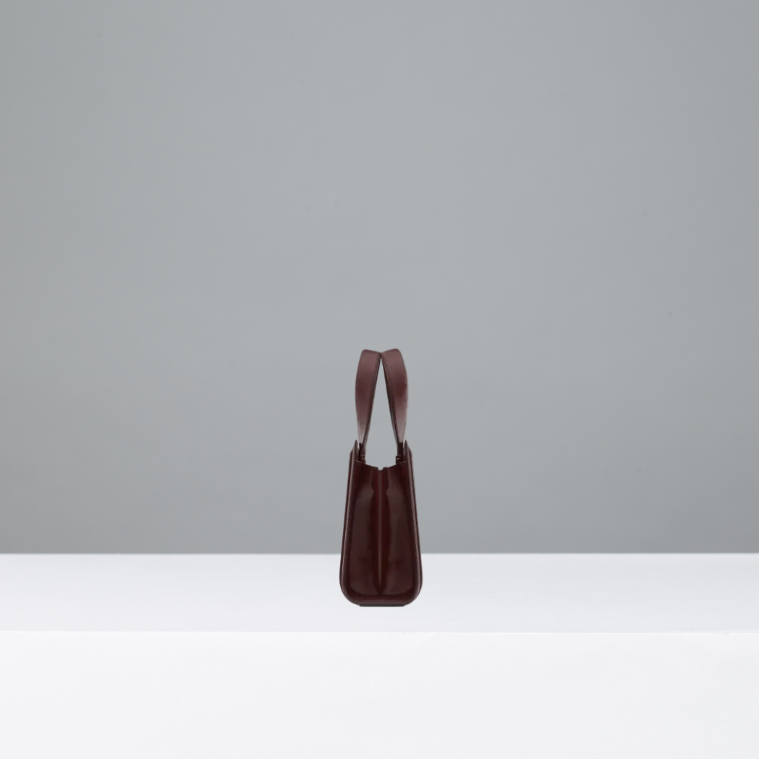 Red handbag on a gray background