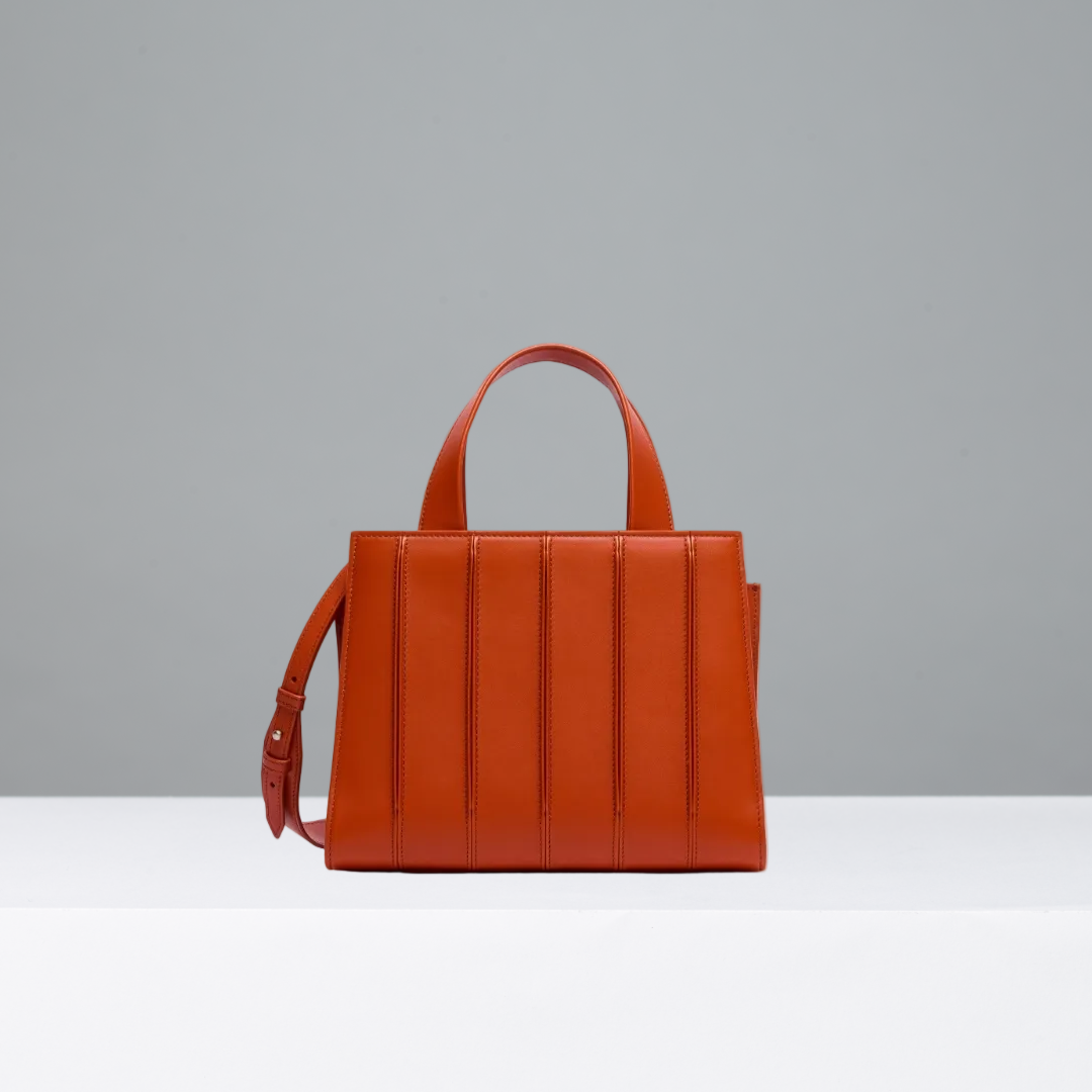 Orange handbag on a gray background