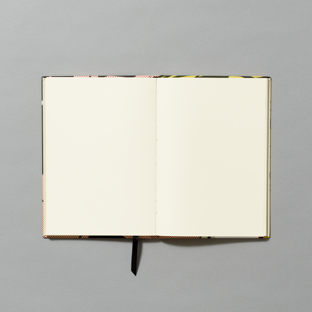 Opened journal with blank pages on a gray background