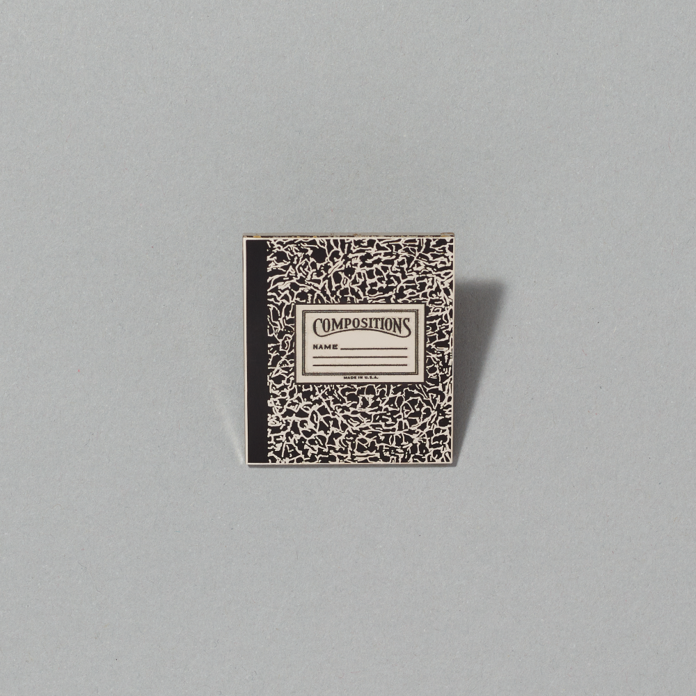 Enamel pin featuring Compositions I by Roy Lichtenstein on a gray background