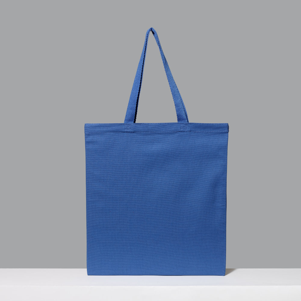 Blue 100% cotton tote bag featuring on a gray background