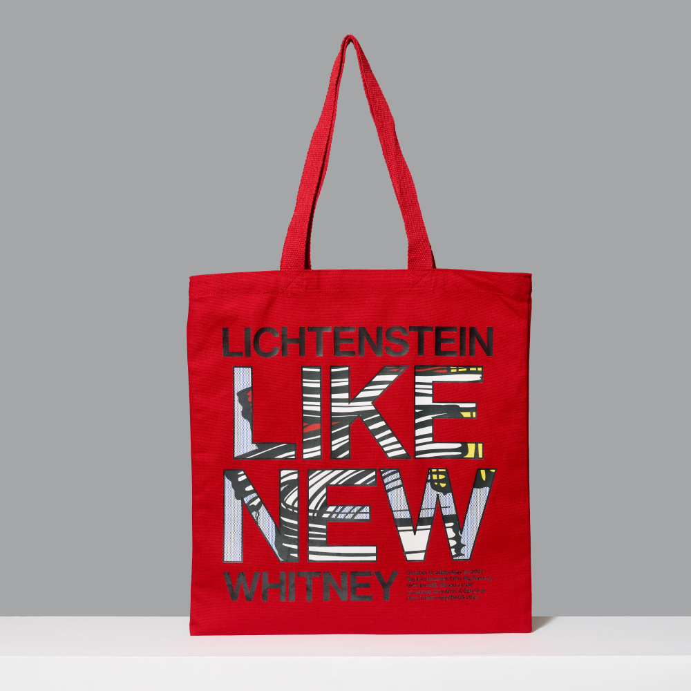 Red 100% cotton tote bag featuring Roy Lichtenstein's Little Big Painting artwork within 'LIKE NEW' and Lichtenstein and Whitney in black screen printed letters on a gray background