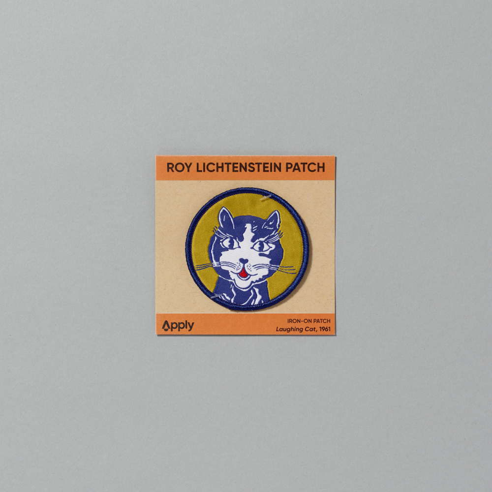 Embroidered iron-on patch featuring Roy Lichtenstein's Laughing Cat against a gray background