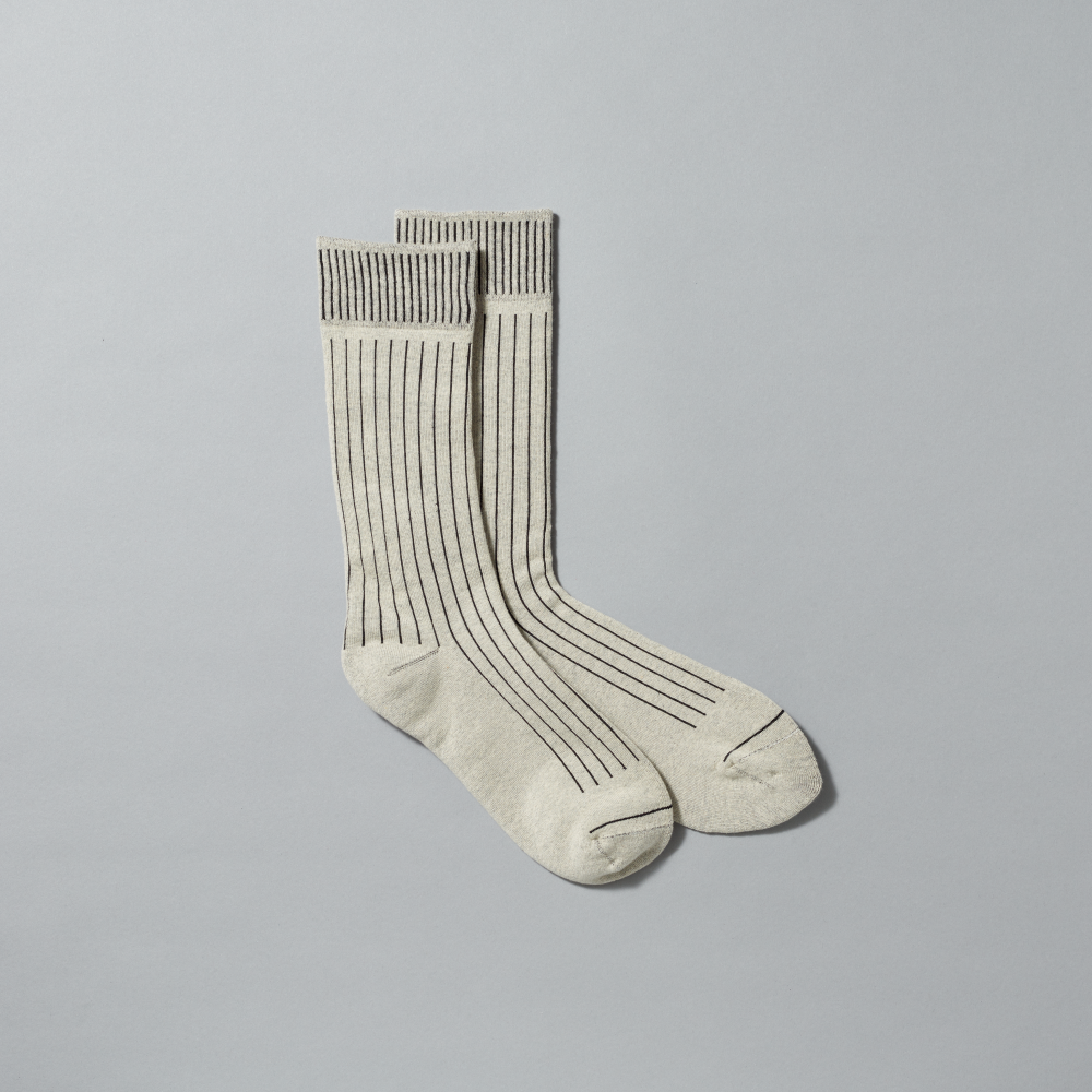 A pair of heather-gray crew socks with thin dark vertical stripes, displayed on a neutral light gray background