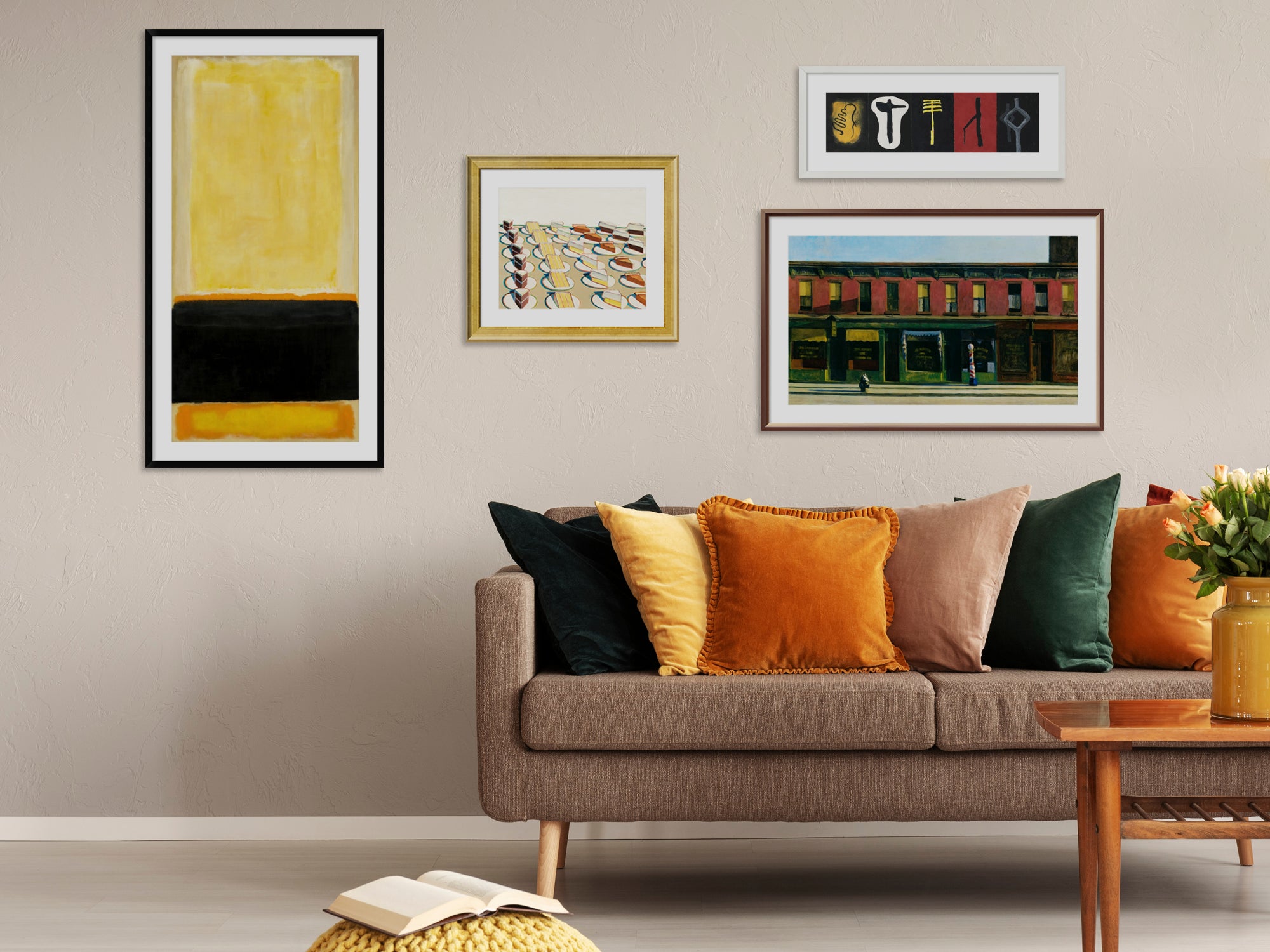 A living room space with framed custom prints hanging on wall