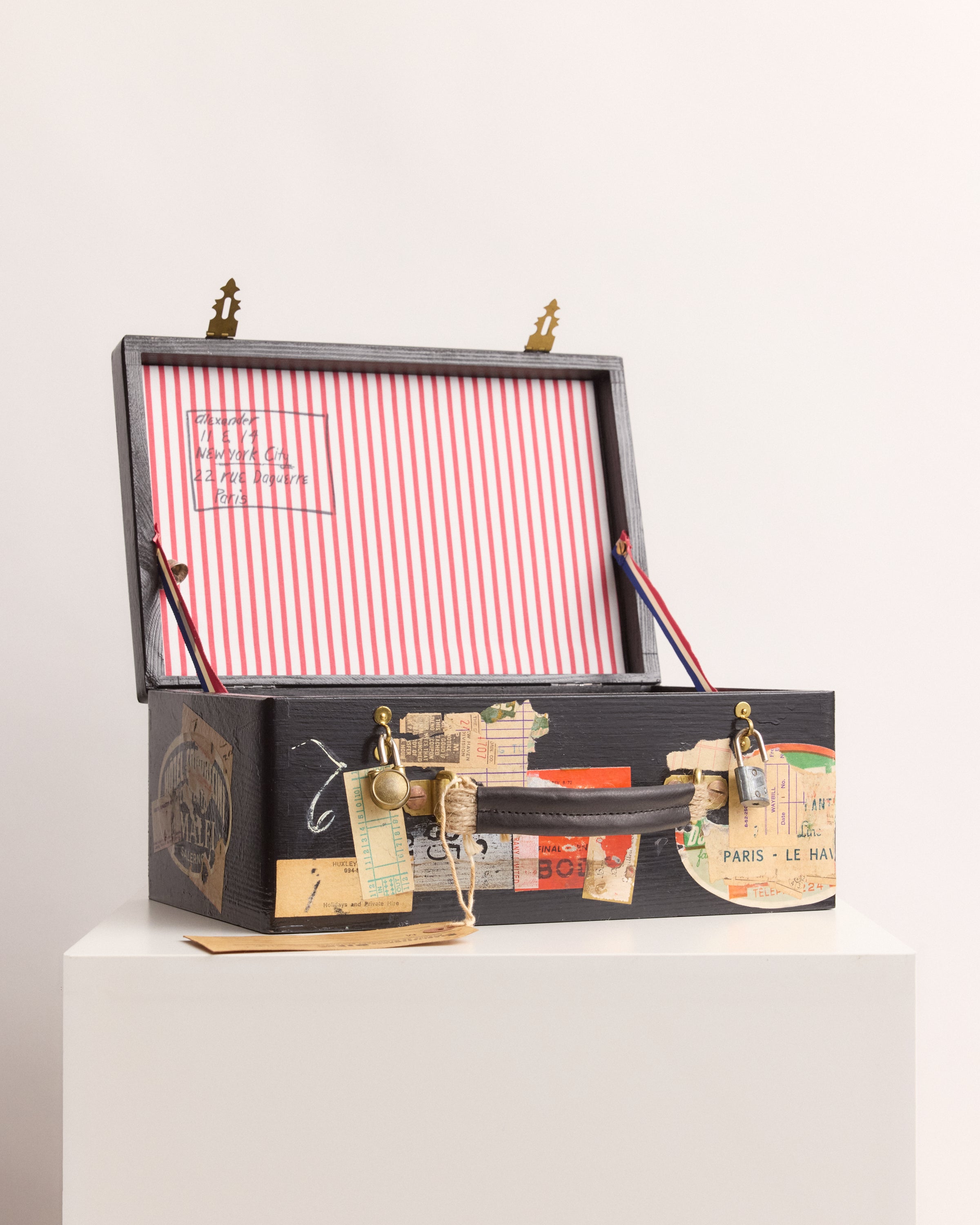 Decorative box with a striped interior on a white background