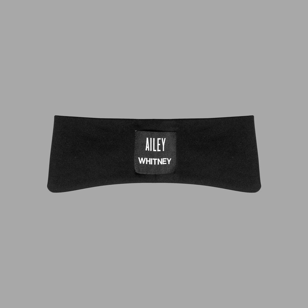 A super soft, four-way stretch, sweat-wicking headband in sport fabric that maintains its shape and hold over time.