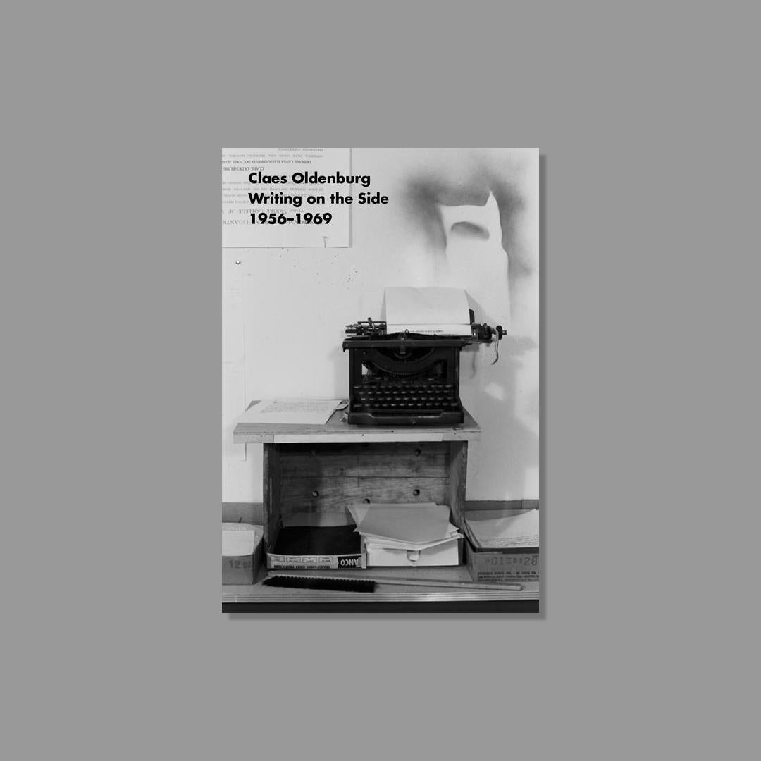 Book cover featuring a black and white photograph of a typewriter and sculpture with text 'Claes Oldenburg Writing on the Side 1956-1969'.