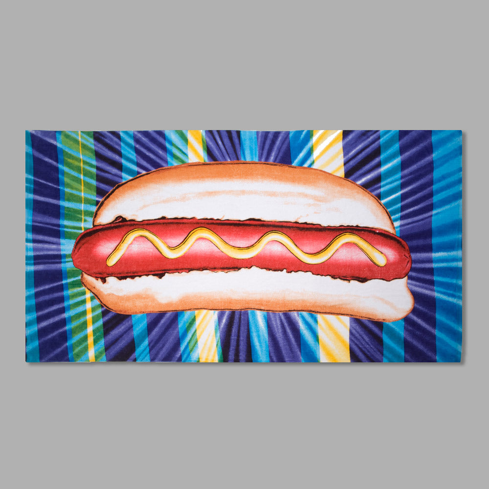 100% Cotton beach towel featuring Kenny Scharf's Hot Dog. Measures 71" x 39".