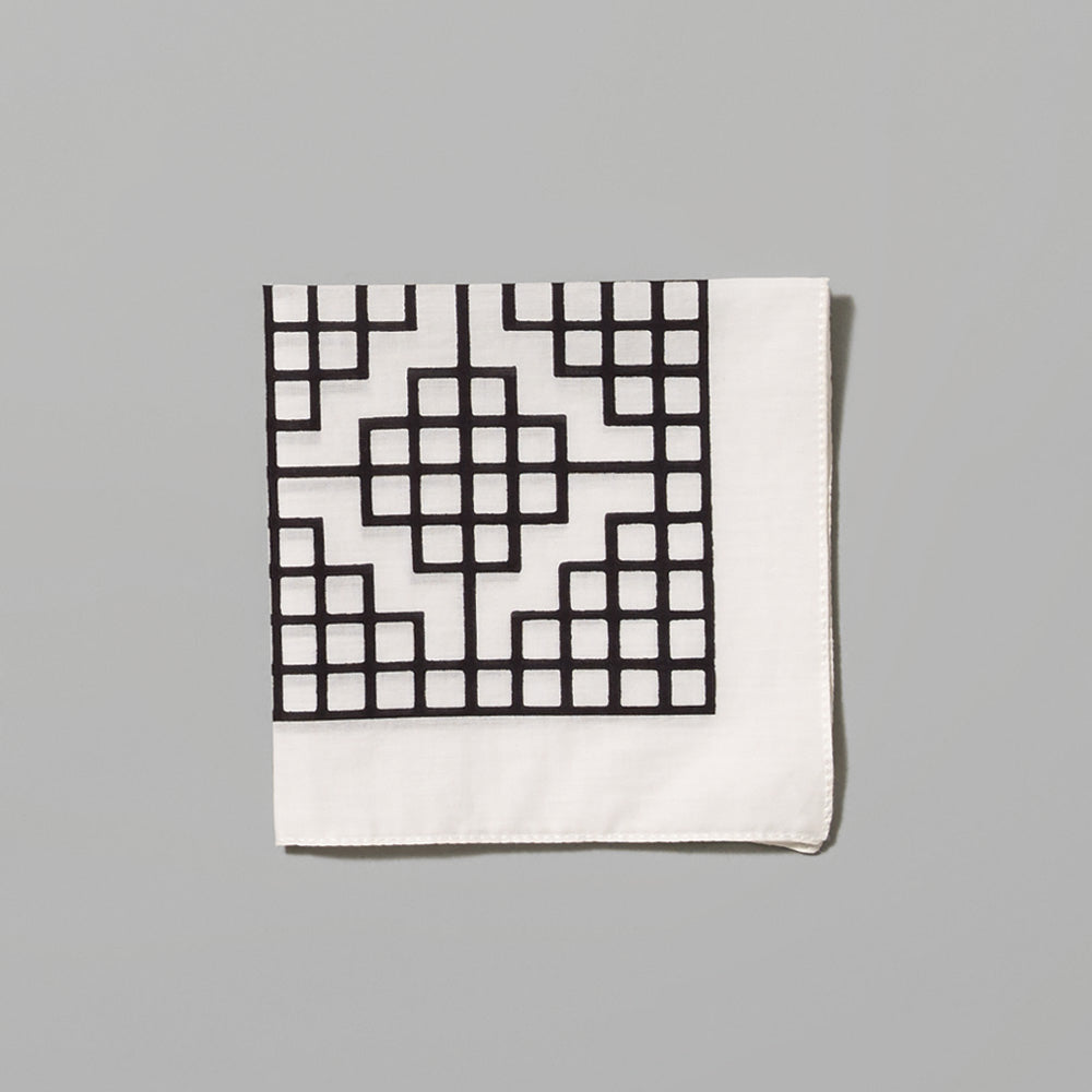 Folded 100% cotton Carol Bove Grid white handkerchief with black grid design. Measures 9.84" x 9.84".