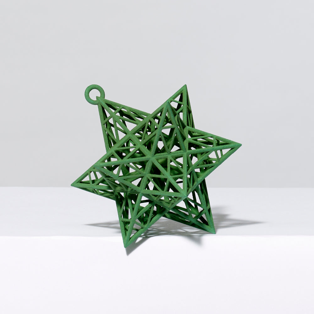 3-D printed plastic Frank Stella star ornament in green. Measures approximately 4" x 4" x 4"