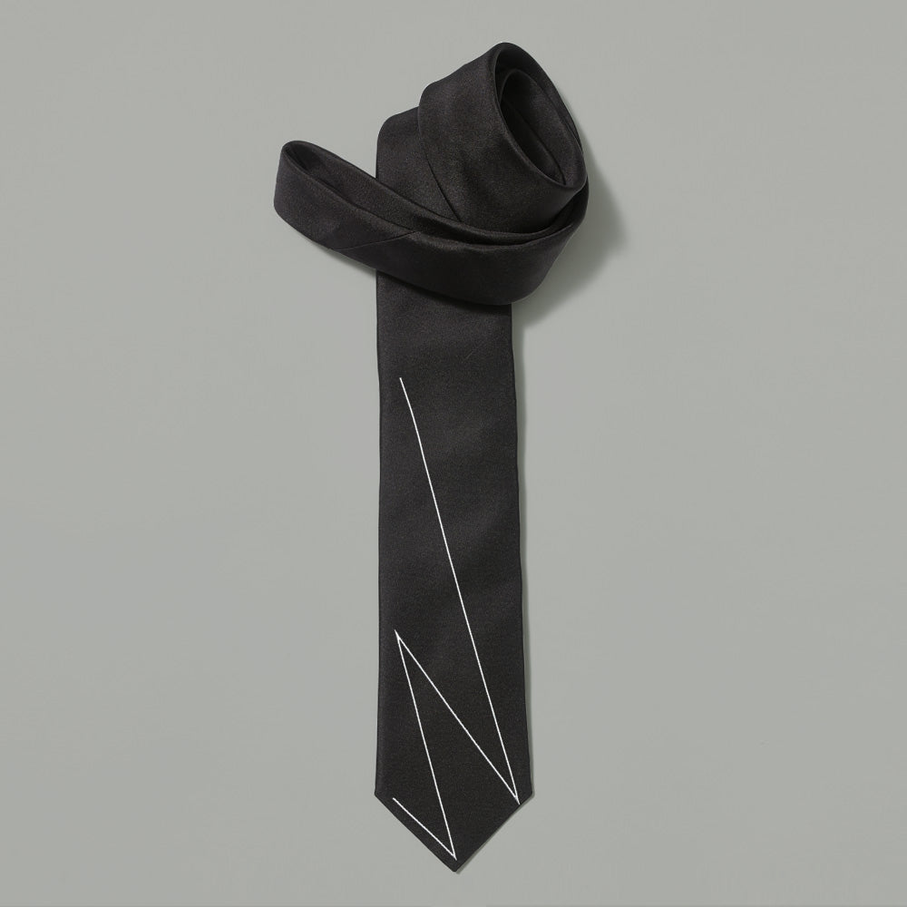 100% silk black tie with Whitney responsive w in white across