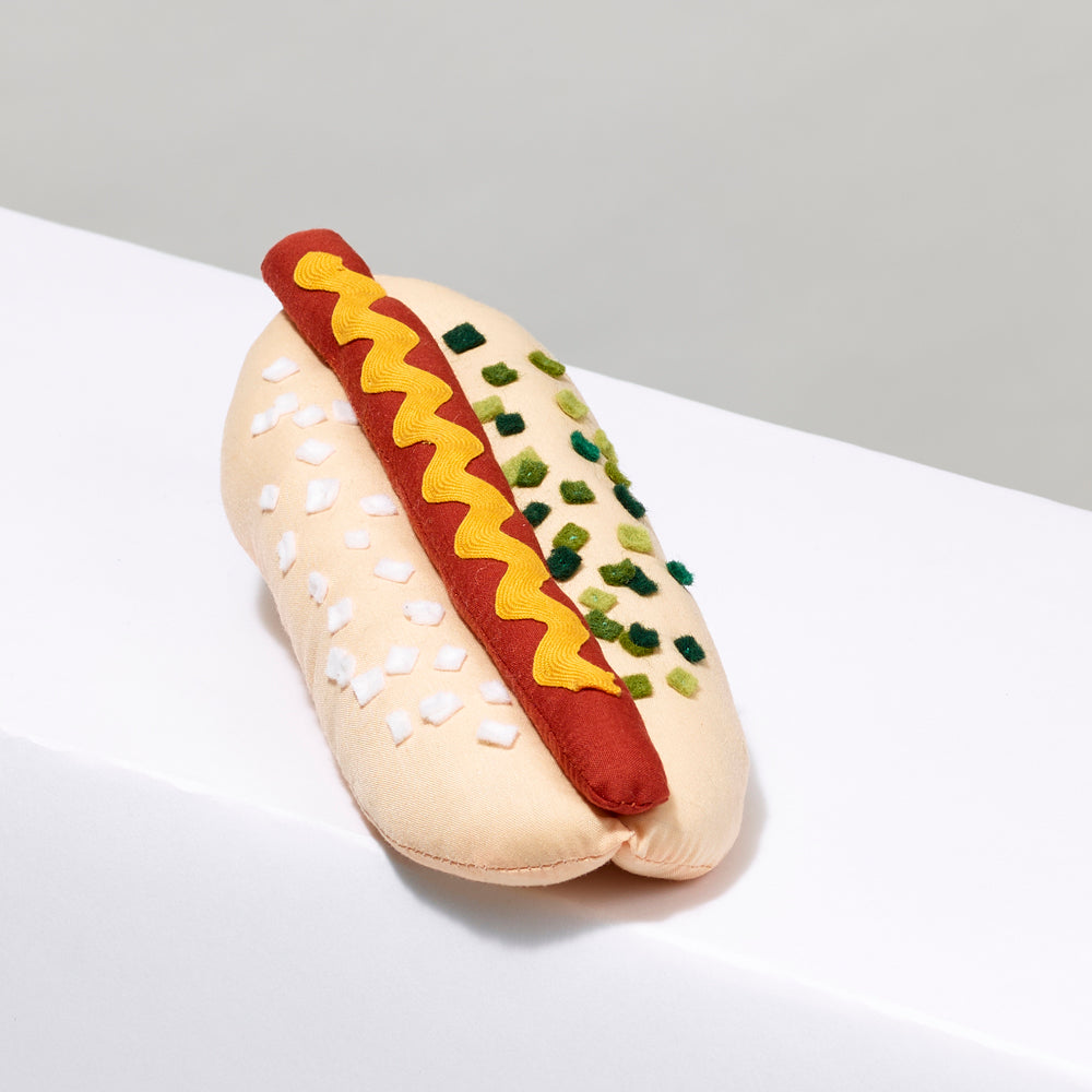 6" long stuffed hot dog with onion, mustard, and relish made of Cotton crepe, cotton thread, felt topping, polyester stuffing.