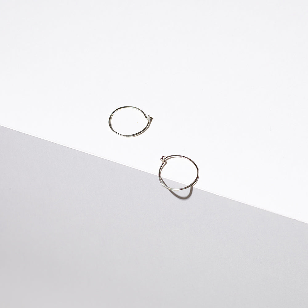 Sterling silver small hoop earrings. Measures 1" in diameter.