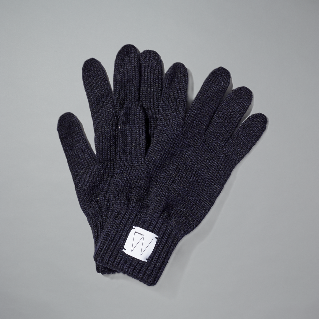 Navy wool gloves with a white Whitney logo on a gray background