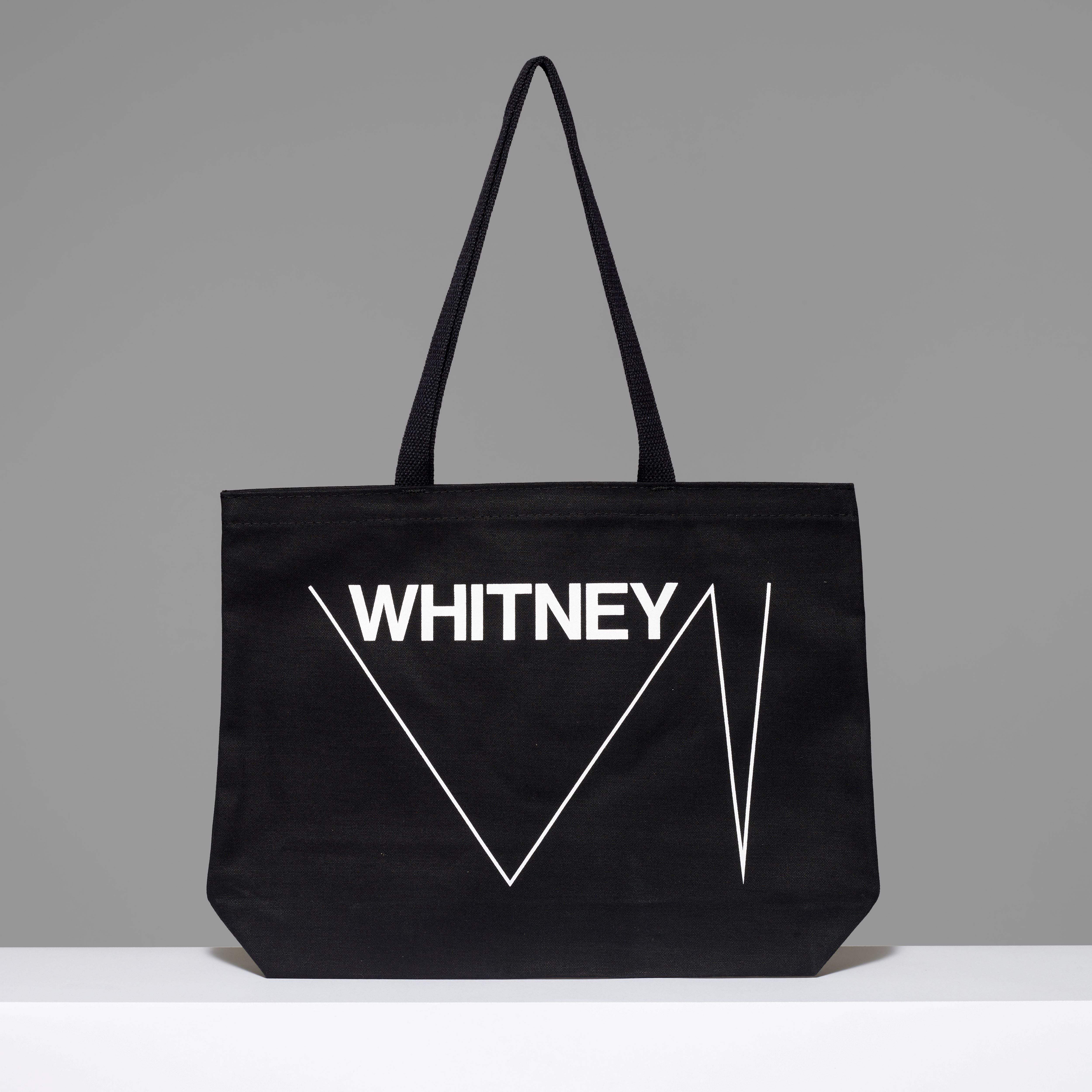 100% cotton black tote with the Whitney and logo text in white written across. Measures 18" x 14". 3.5" gusset, 11" handles.