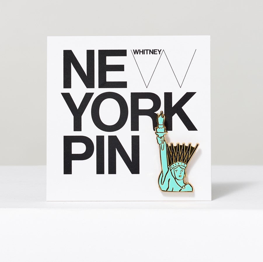 Lady Liberty hard enamel and metal pin illustrated by Tamara Shopsin.