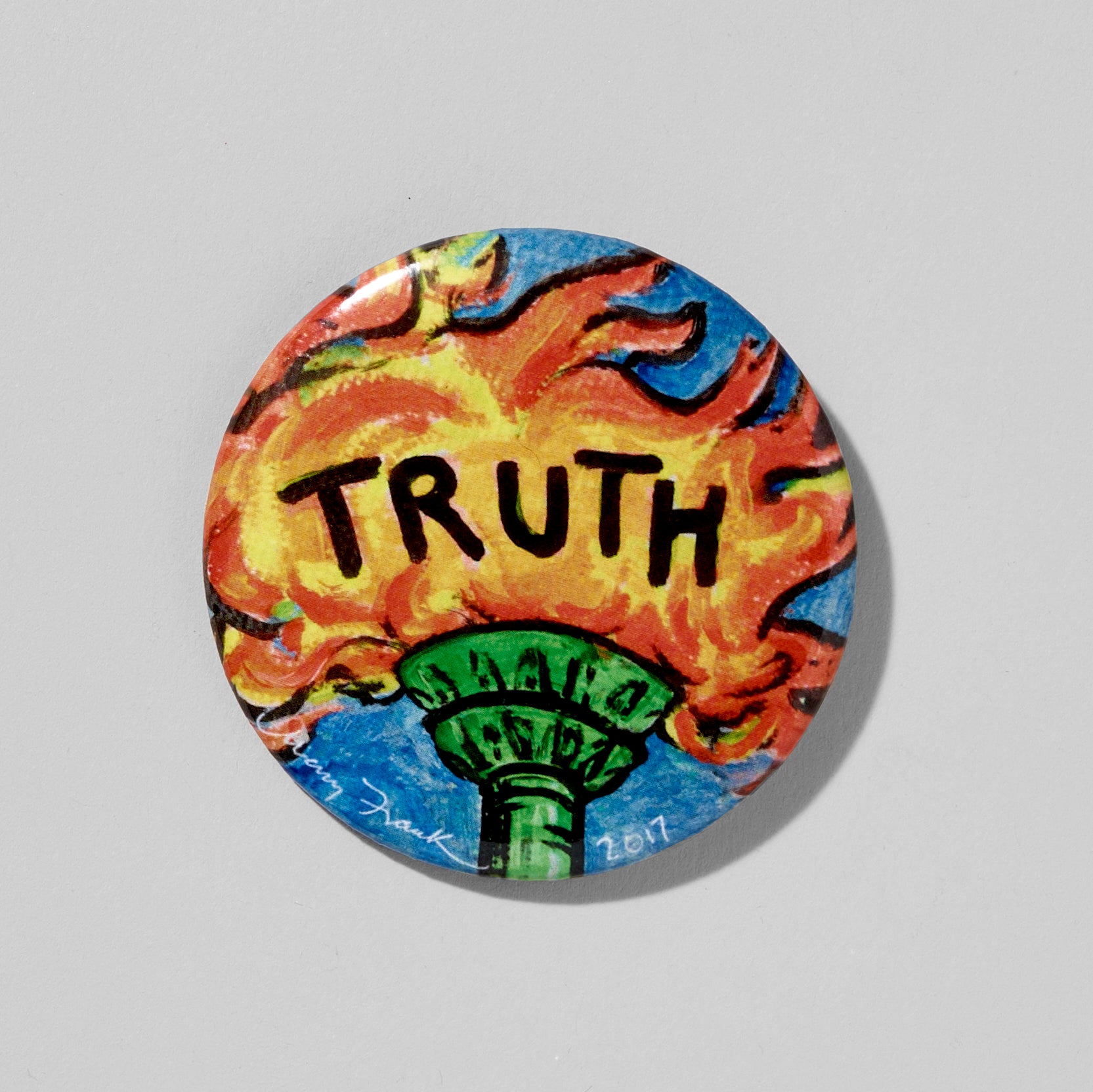 2.25" Diameter round Truth button by artist Mary Frank