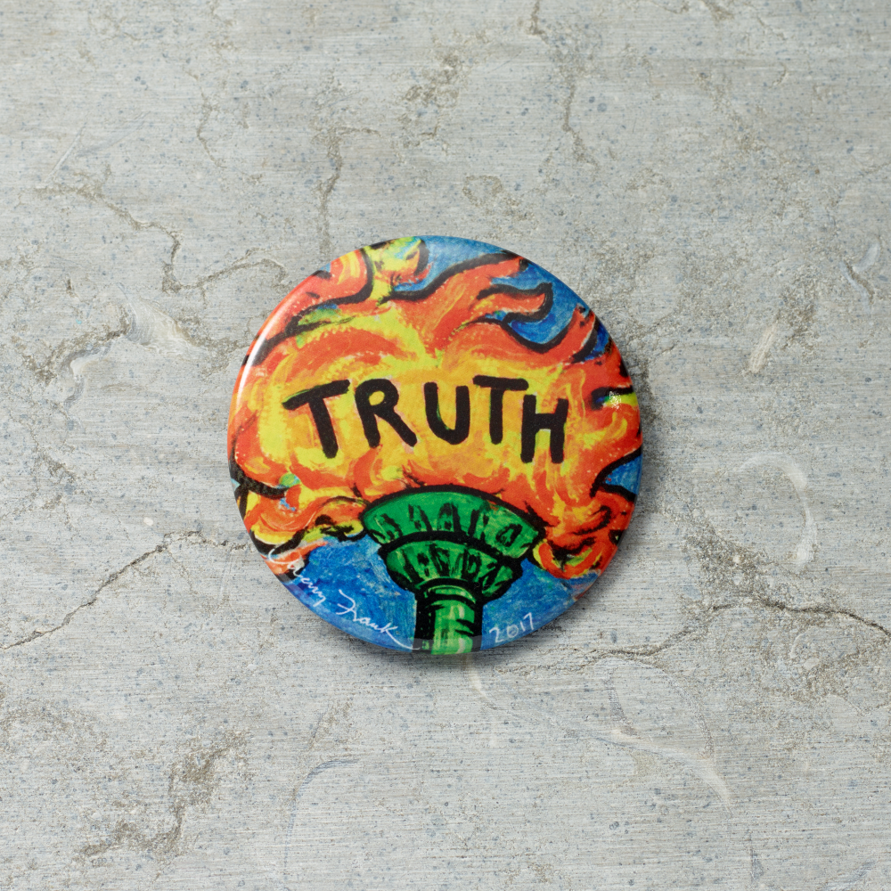 Colorful button badge with 'TRUTH' text on a textured surface