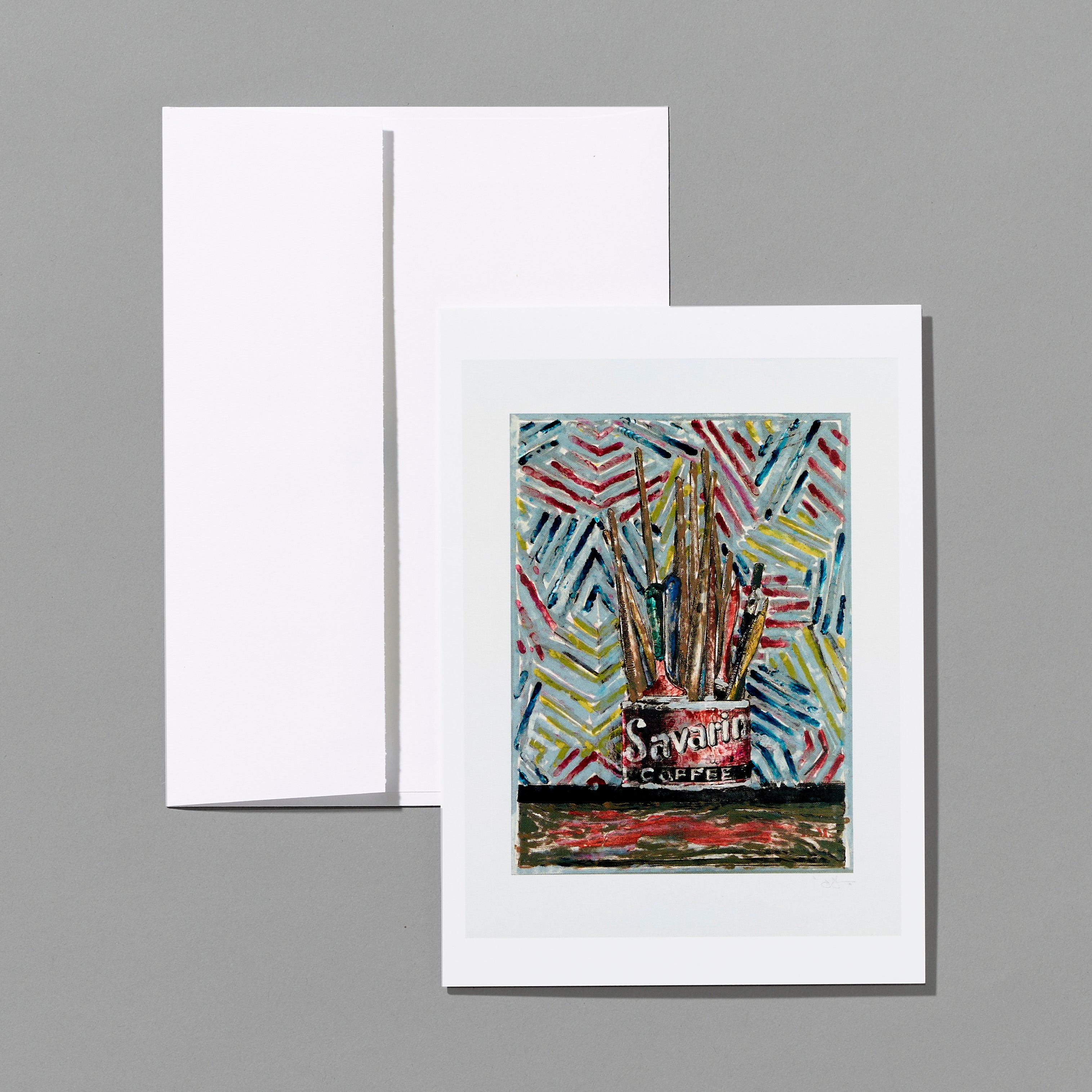 Notecard featuring Jasper Johns' Savarin and white envelope on a gray background