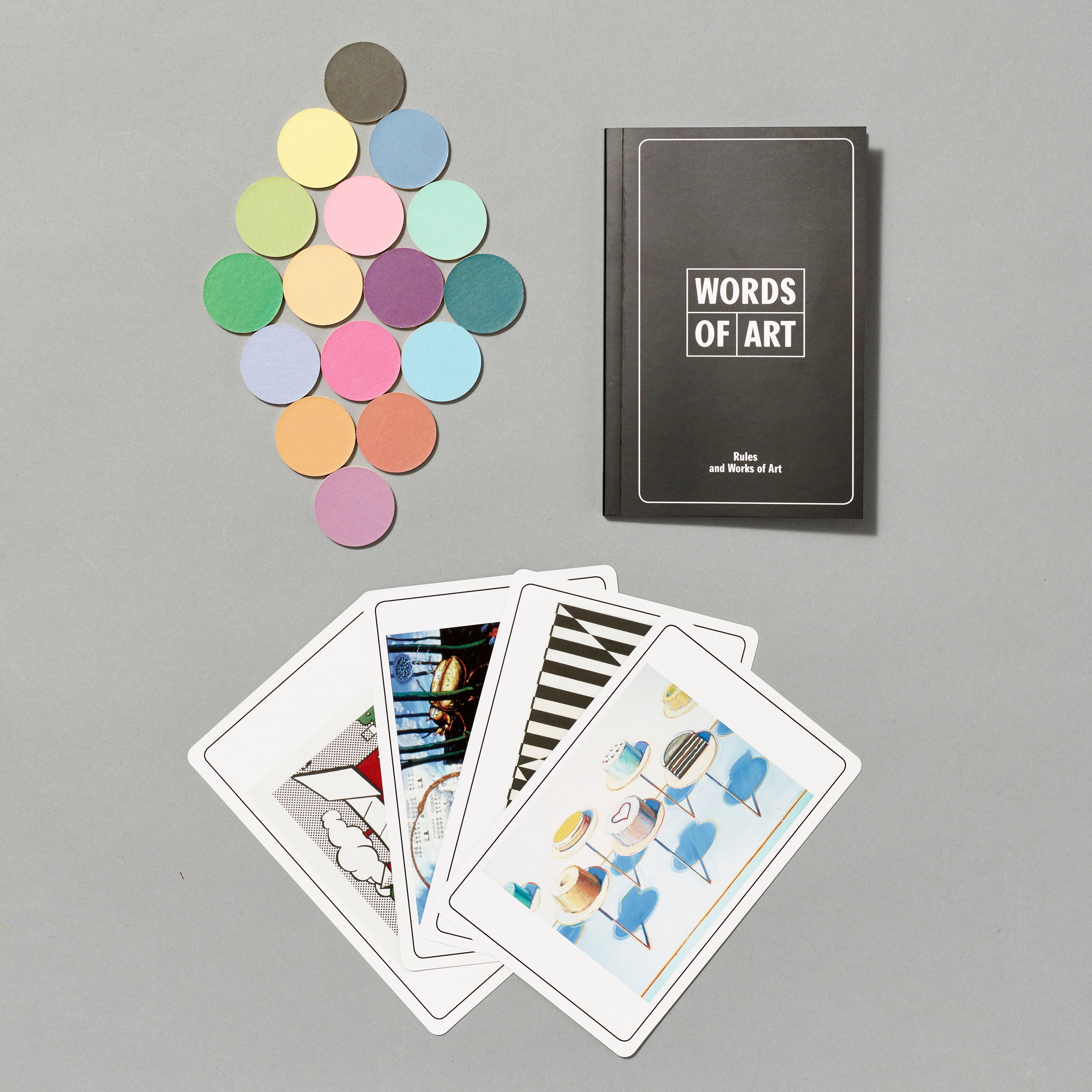 Words of art box set pieces featuring tokens, rule book, and assortment of cards.