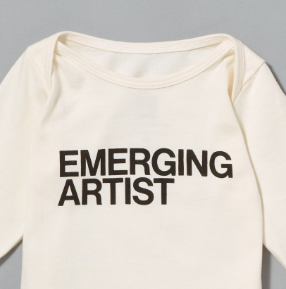 100% certified organic cotton white baby t-shirt with "Emerging Artist" written in black text on the front