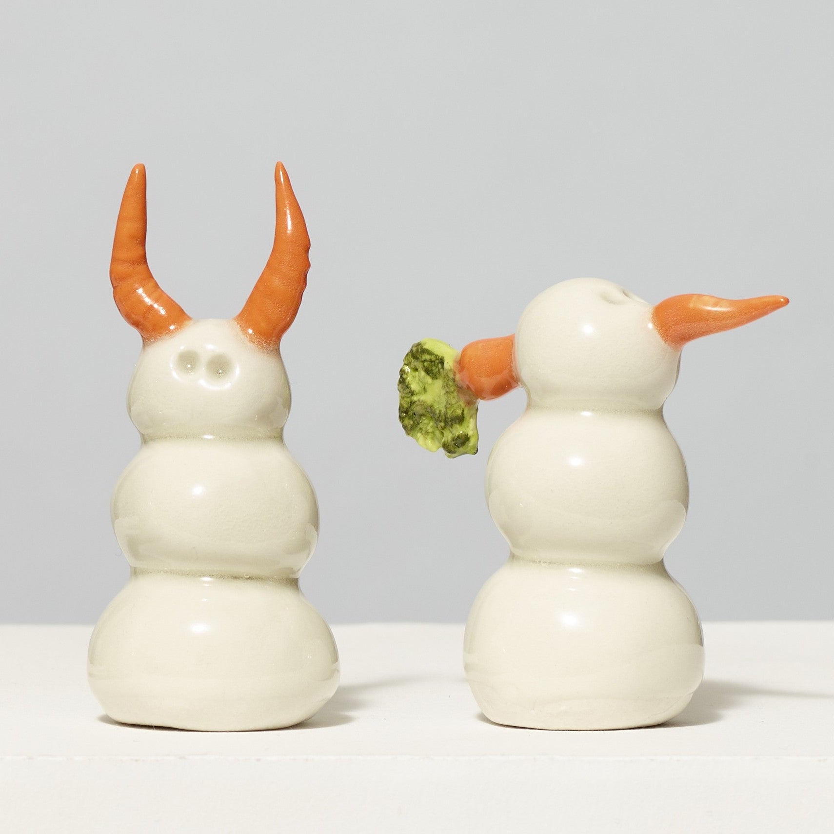 Assortment of 100% porcelain snow people. Each measures 2"-3" tall.