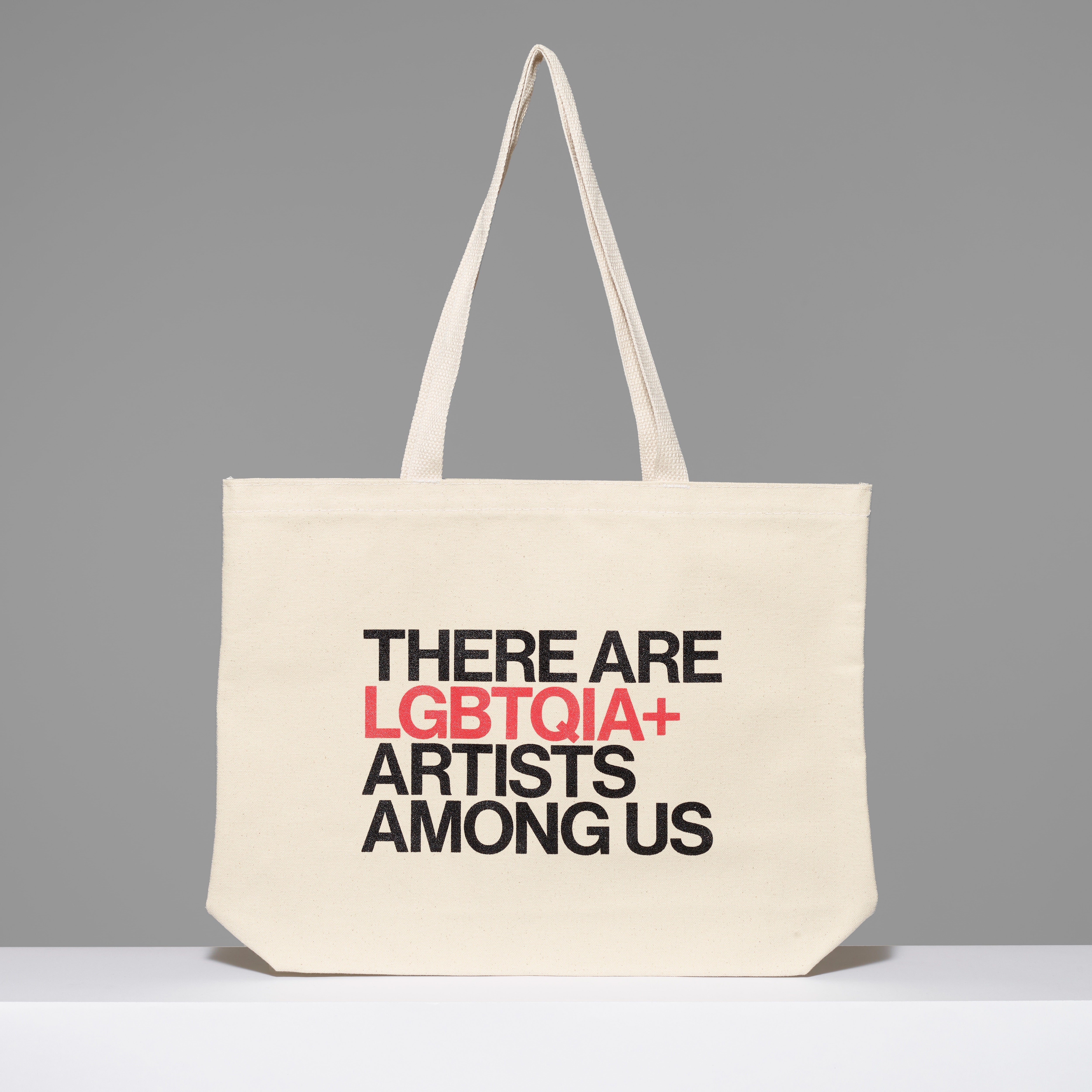 100% cotton There Are LGBTQIA+ Artists Among Us Tote with black and red text. Measures 18" x 14". 3.5" gusset, 11" handles.