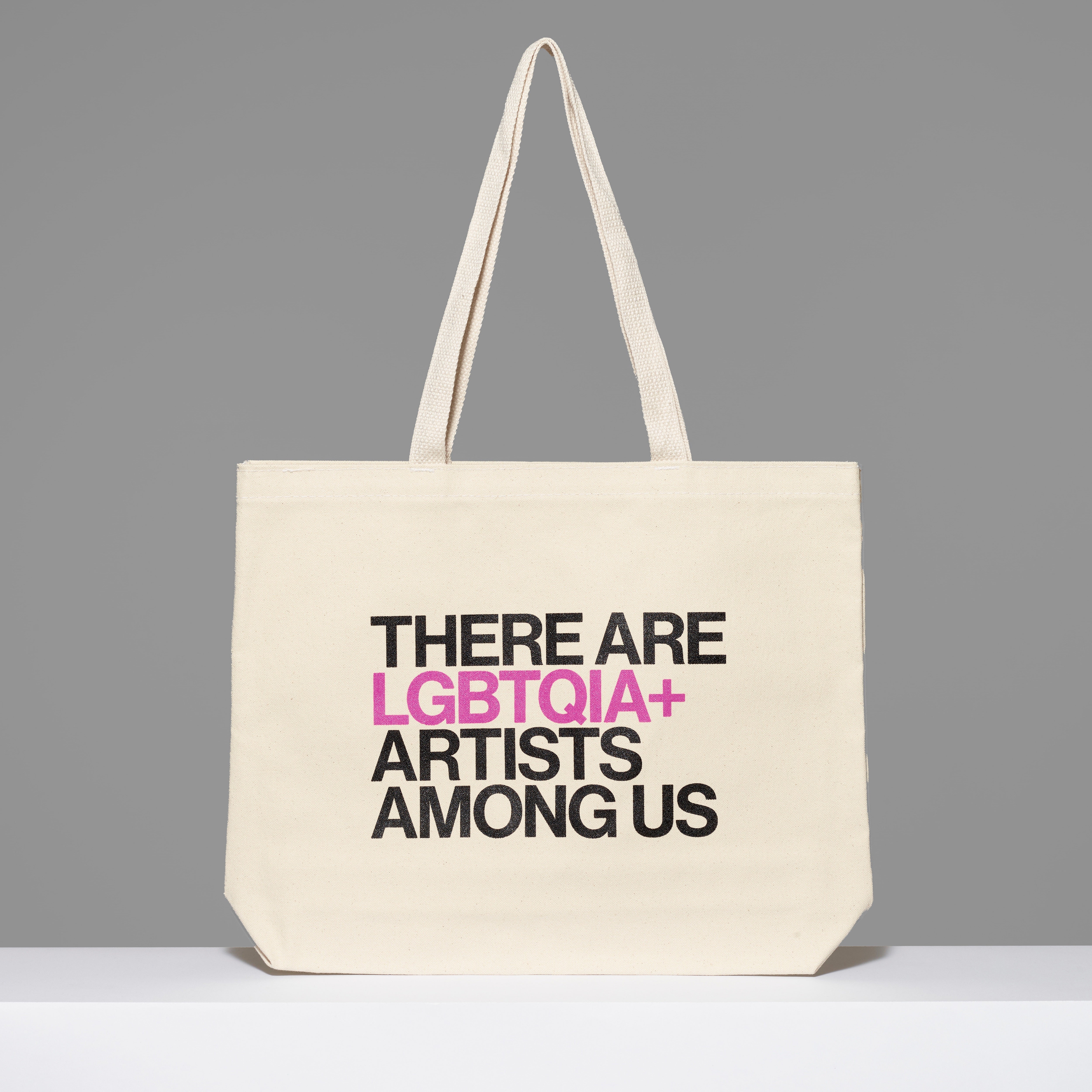 100% cotton There Are LGBTQIA+ Artists Among Us Tote with black and purple text. Measures 18" x 14". 3.5" gusset, 11" handles.
