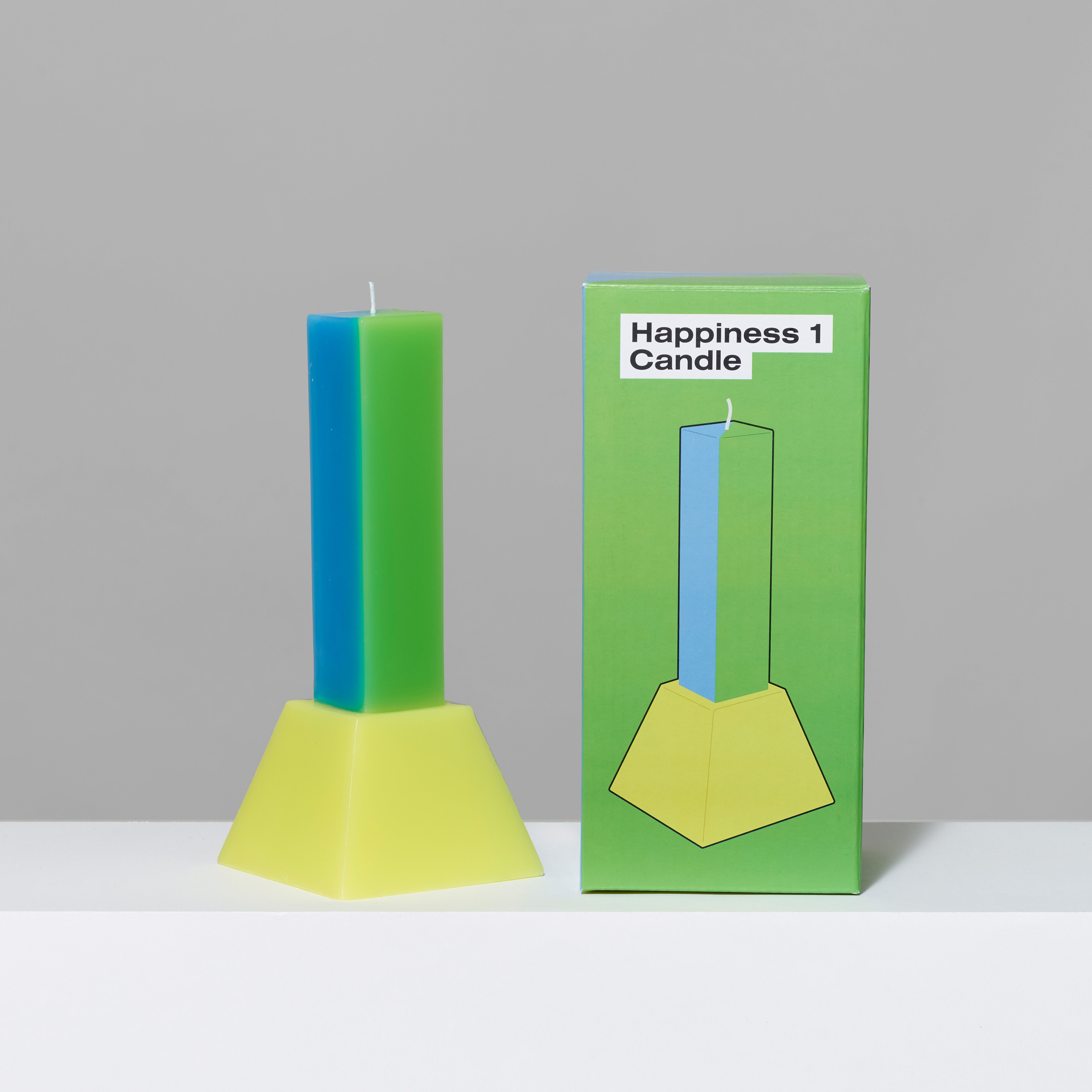 Paraffin wax Blue/Green Happiness Pillar Candle and box. Measures 4" x 4" x 9".