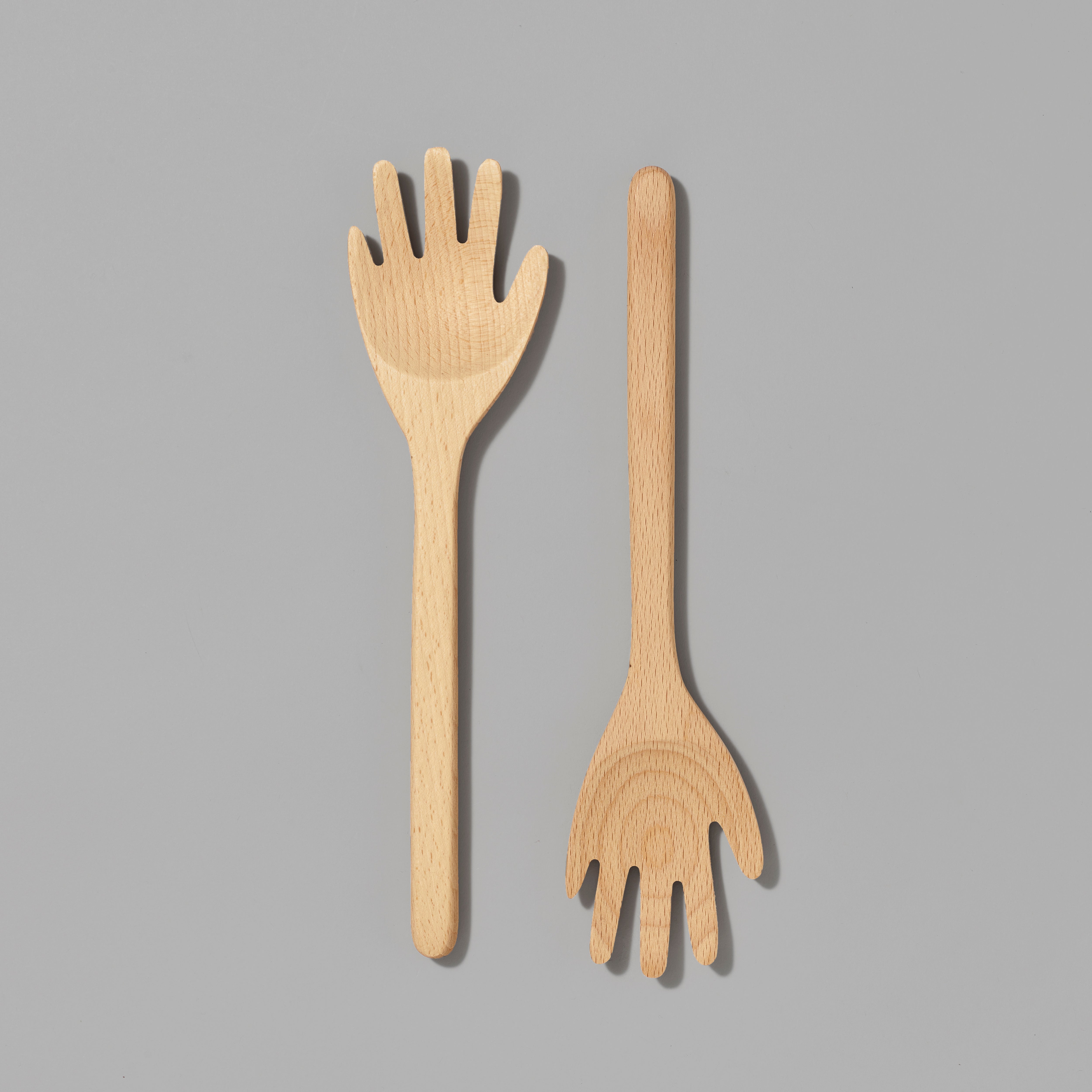 Set of 2 Beech wood hand-shaped serving spoons. Each measures" 3 x 12".
