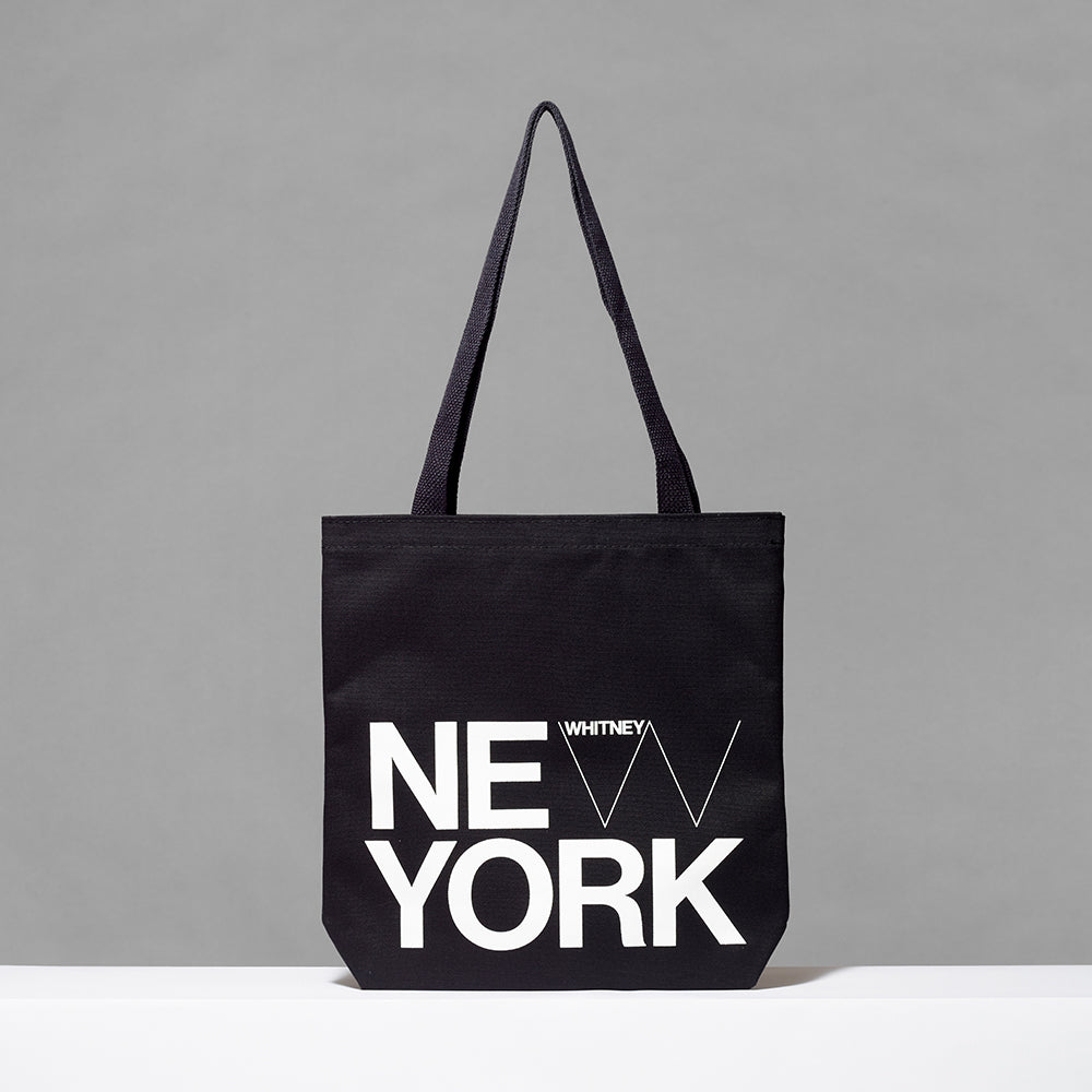 100% cotton black tote with New York and Whitney logo screen printed in white. Measures 13.5" x 13.75". 3.5" gusset, 12" handles