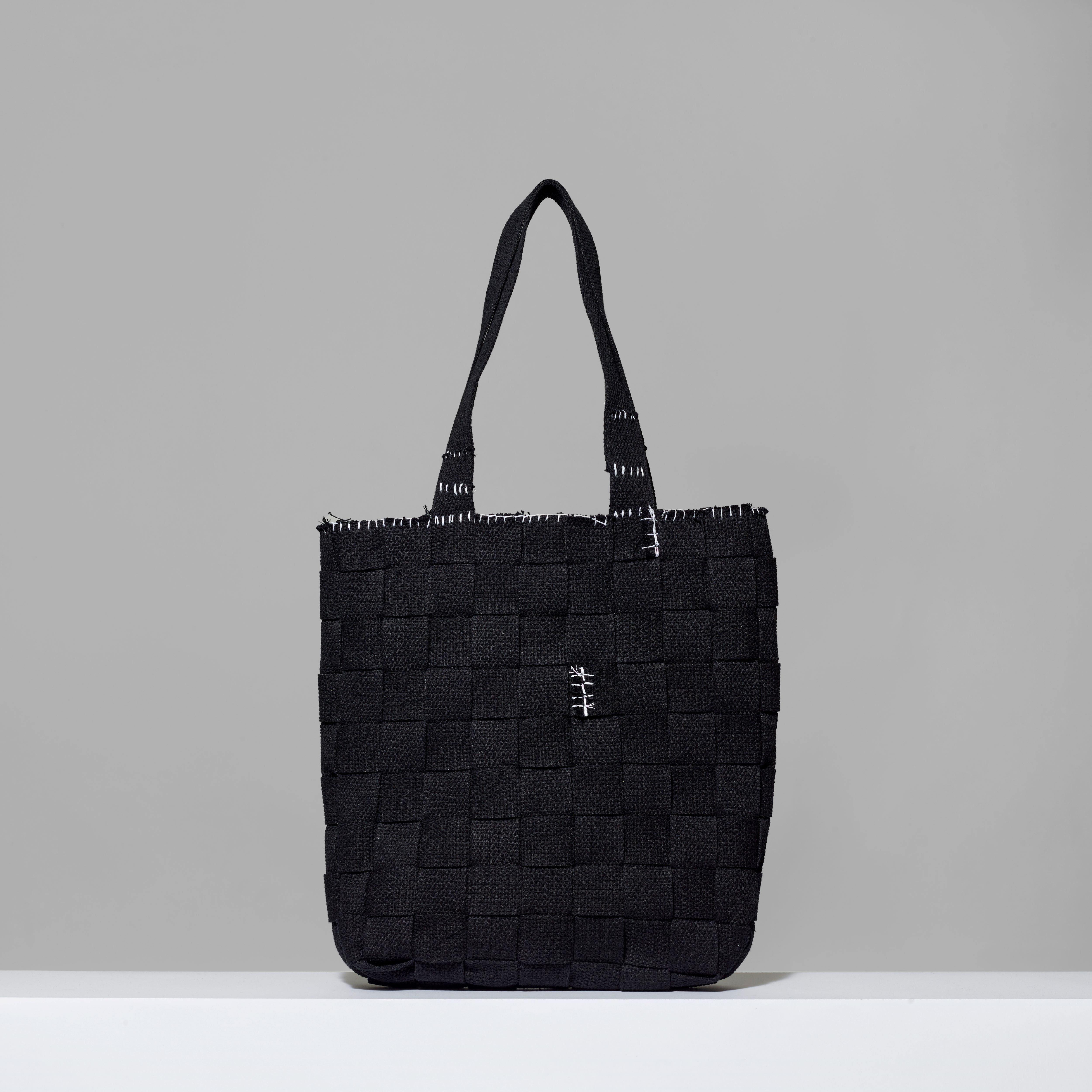 Black 100% cotton canvas bag by VEHICLE. Measures 16" H x 15" L x 3" W
