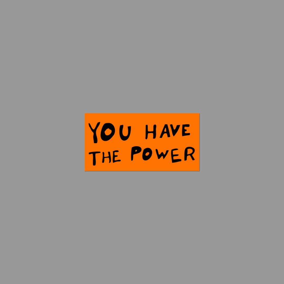 Orange sticker with 'YOU HAVE THE POWER' text on a gray background