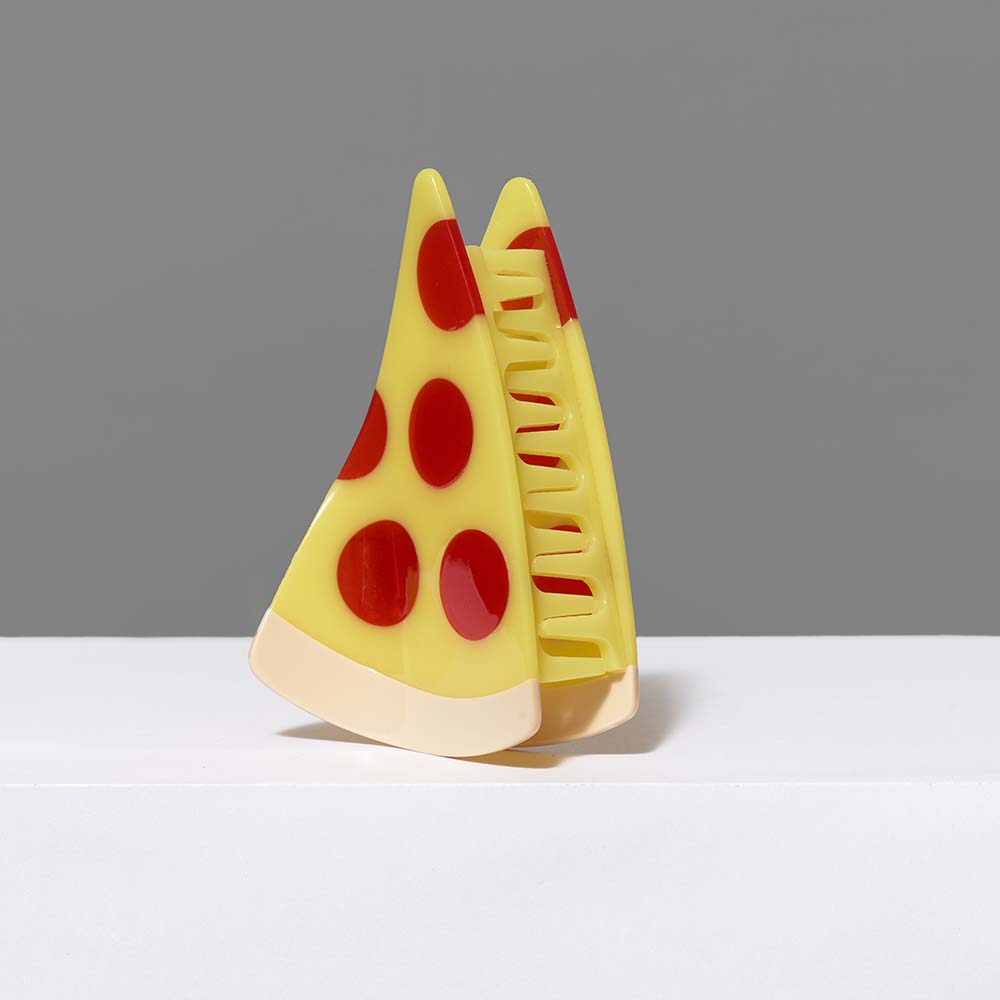 Cellulose acetate pizza hair claw clip. Measures 4" x 2".