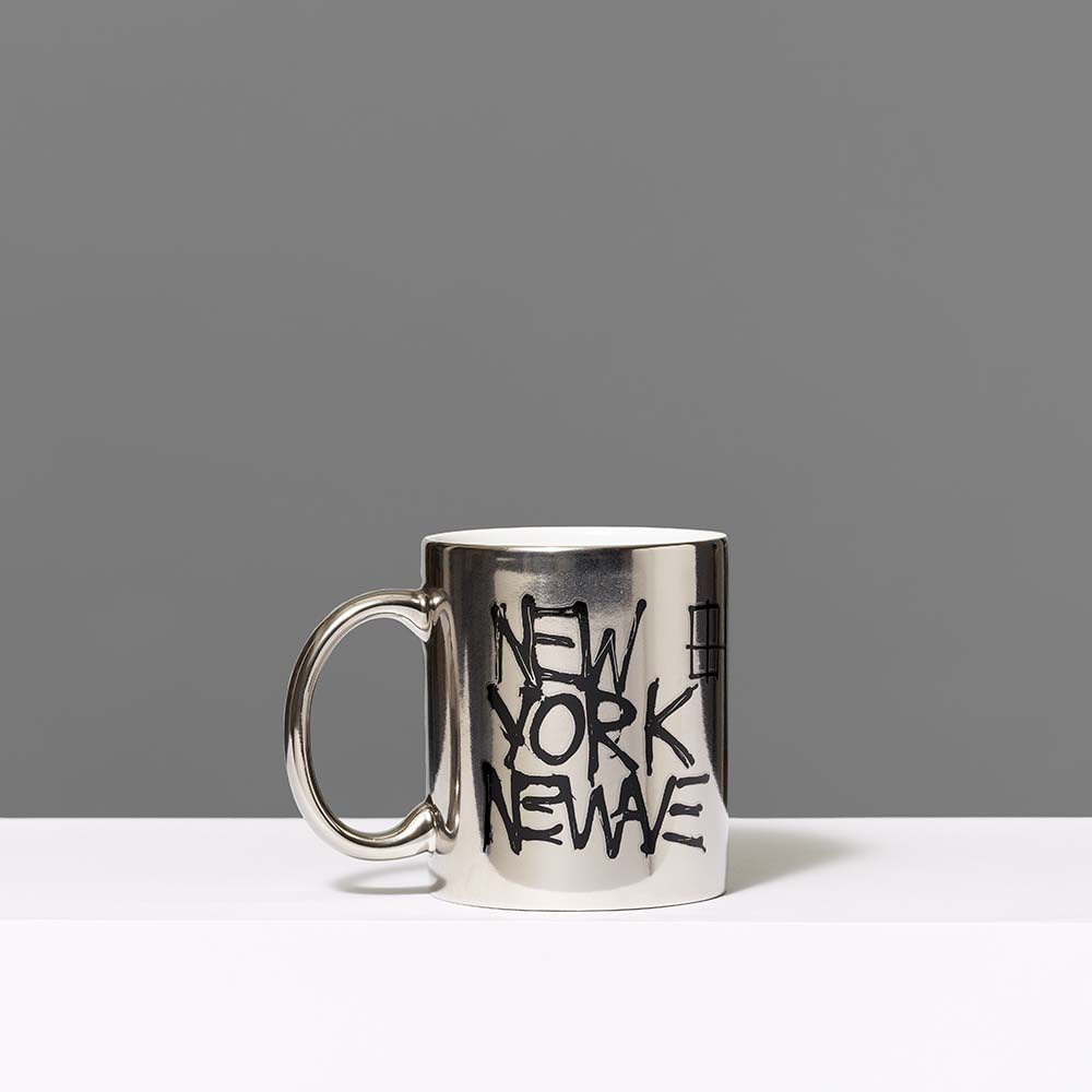 100% ceramic silver mug featuring Basquiat's New York/New Wave artwork in black text. Measures 3.75" x 3"