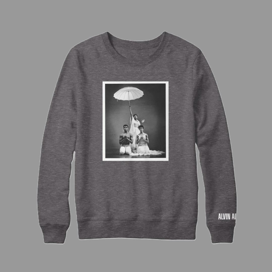 65% cotton and 35% poloyester grey pullover crewneck with Alvin Ailey's Revelations on the front and the Alvin Ailey logo on the left sleeve