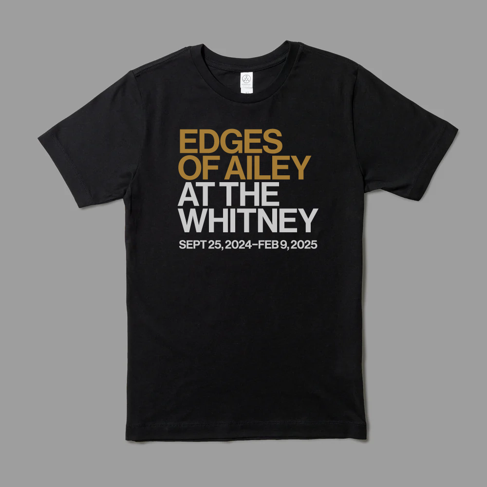 Black 100% cotton t-shirt with Edges of Ailey in gold and At the Whitney with exhibition dates in white text