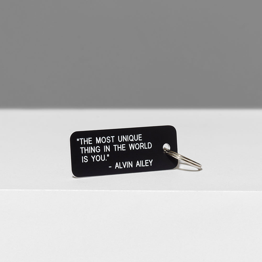 100% acrylic black keychain with "The most unique thing in the world is you" quote by Alvin Ailey