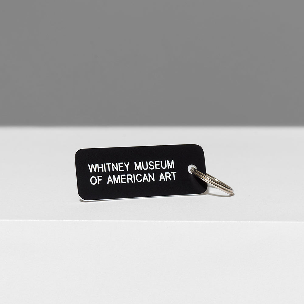 100% acrylic black keychain with Whitney Museum of American Art in white text