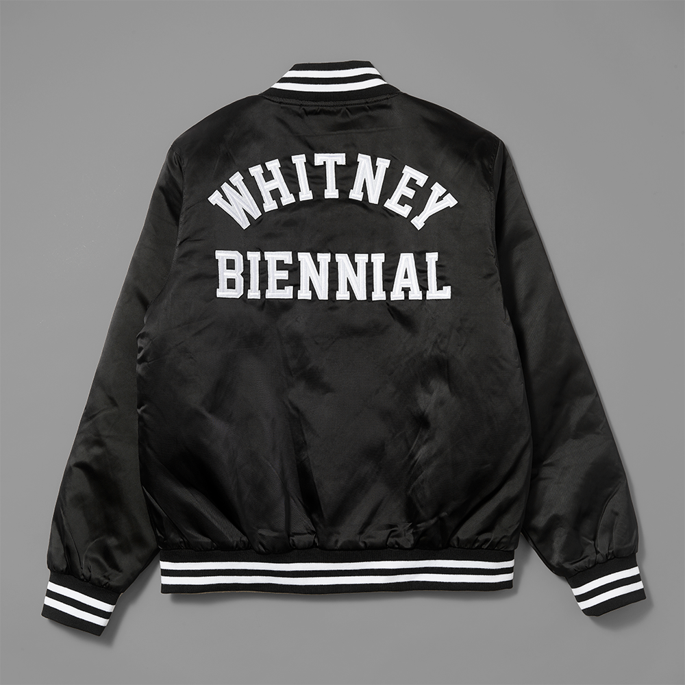 100% polyester black stadium jacket with Whitney Biennial stitched in white on the back.