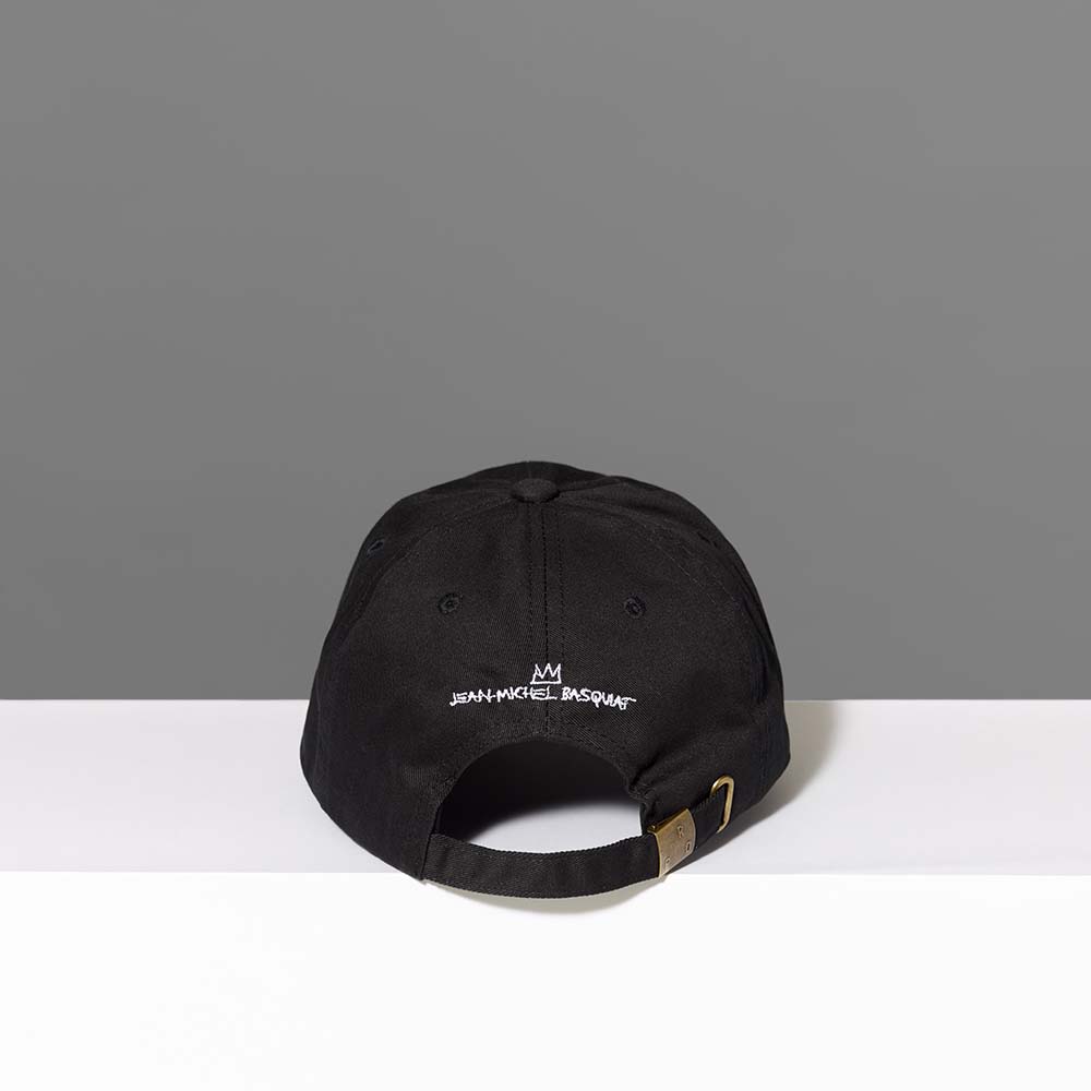 Back of the 100% cotton twill black baseball cap featuring Basquiat's logo in white embroidery