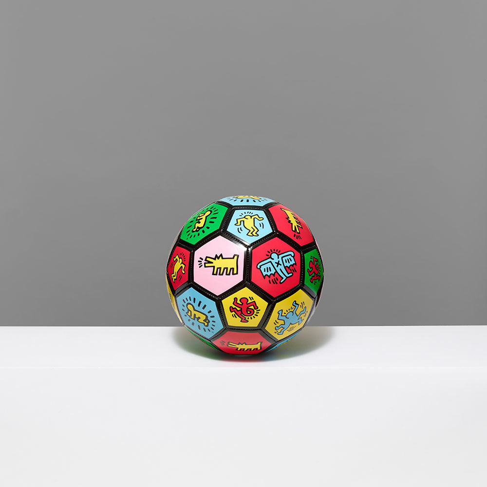 Standard thermoplastic polyurethane soccer ball as canvas featuring symbols and works by Keith Haring