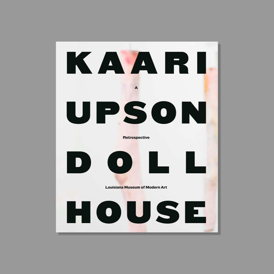 Book cover of 'Kaari Upson Doll House' retrospective at the Louisiana Museum of Modern Art on a gray background