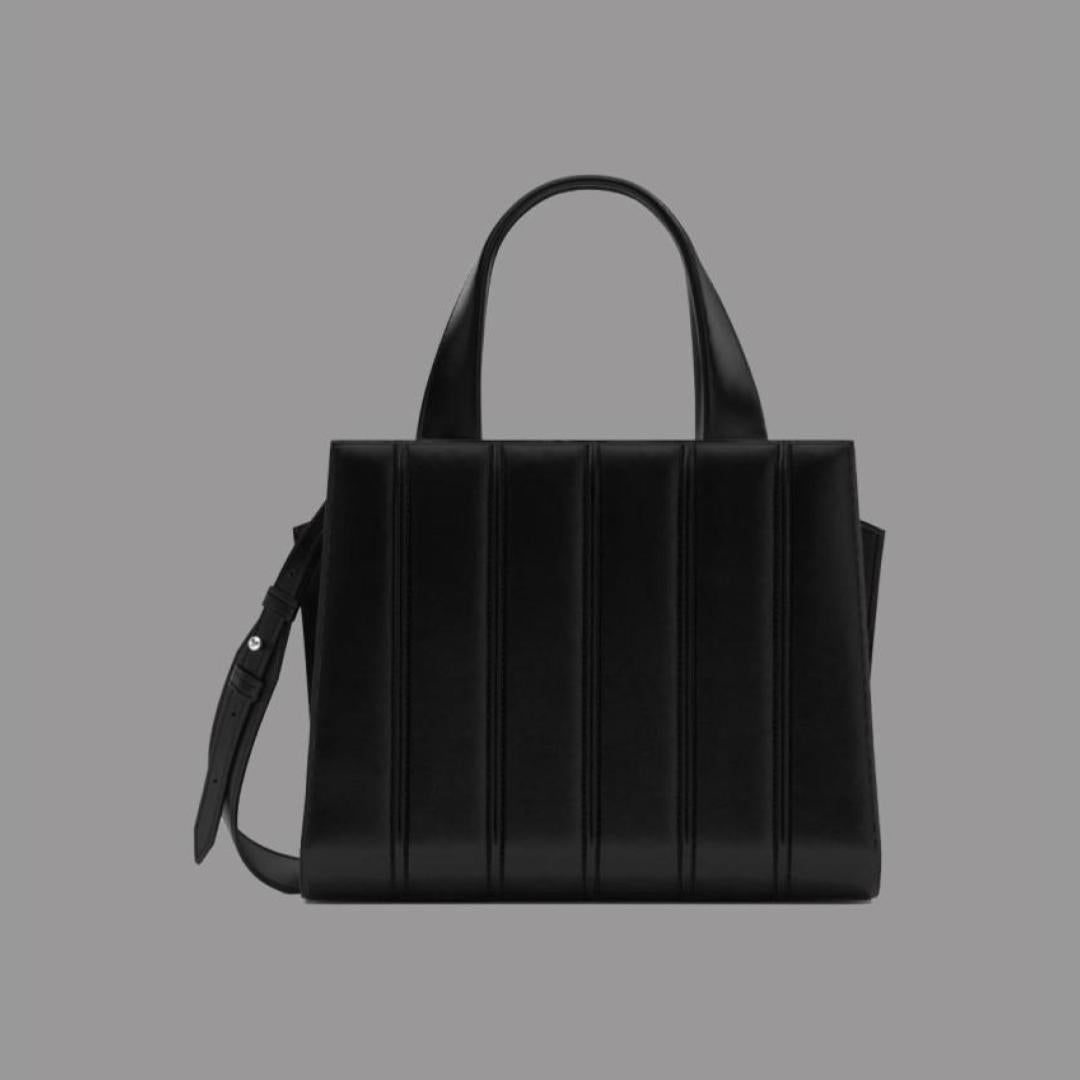 Black handbag on a gray background